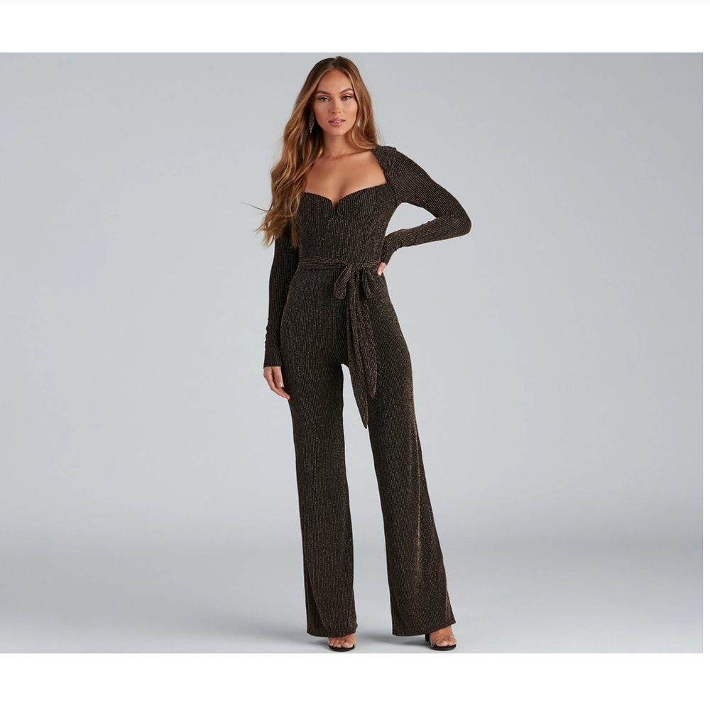 Black jumpsuit with gold details. Soft material and never worn!